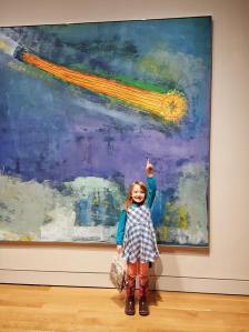 My niece exploring the art gallery. Kids need to know right away that someone made that painting. 